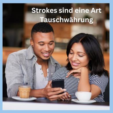 Lächelndes Paar mit Handy als Symbol für positive Anerkennung